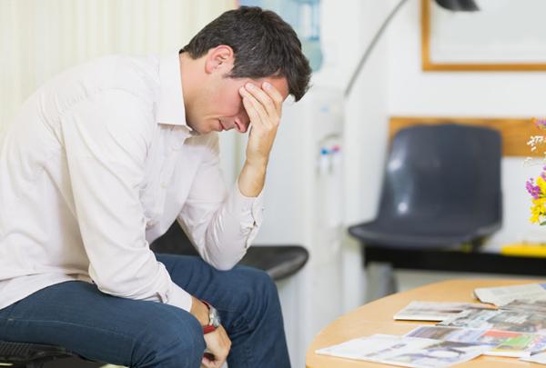 Exasperated man in doctor's waiting room.