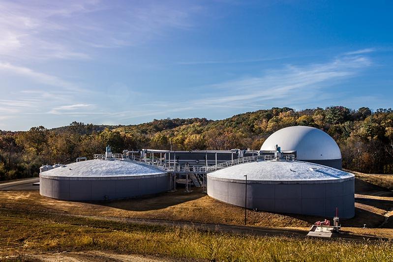 Domed grey and white wastewater processing tanks