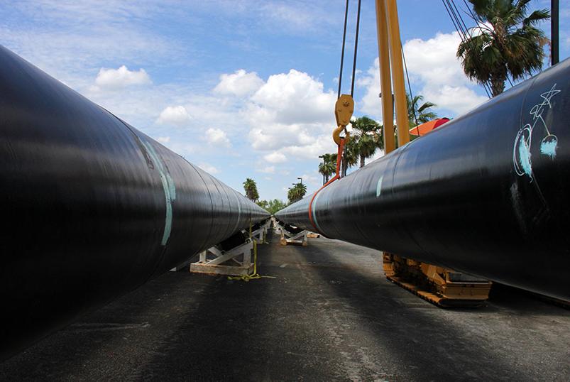 Two large black pipes at eye level on jobsite